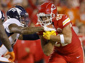 Travis Kelce of the Kansas City Chiefs is brought down by Pat Surtain II of the Denver Broncos.