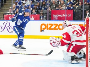 Toronto Maple Leafs' Matthew Knies shoots at Detroit Red Wings goaltender Alex Lyon.