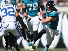 Trevor Lawrence of the Jacksonville Jaguars runs with the ball during the second quarter against the Indianapolis Colts.