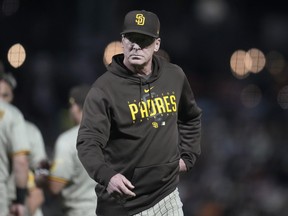 San Diego Padres manager Bob Melvin walks to the dugout after making a pitching change.