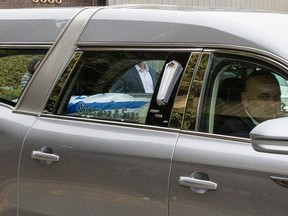 An Israeli flag covers the coffin carrying Alexandre Look's body in the hearse as it leaves the funeral home following service in Montreal on Thursday, Oct. 26, 2023. Look was one of the Canadians killed in the Hamas attack in Israel earlier this month.