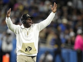 Colorado head coach Deion Sanders gestures during the second half of an NCAA college football game against UCLA.
