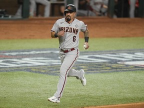 Arizona Diamondbacks' Jace Peterson scores on a two-run single by Emmanuel Rivera during the ninth inning in Game 2.
