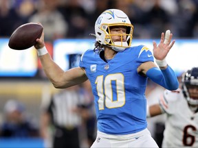 Justin Herbert of the Los Angeles Chargers throws a pass in the first quarter against the Chicago Bears.