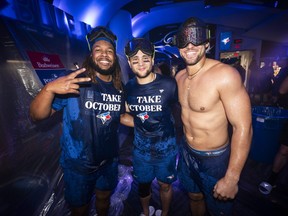 Vladimir Guerrero Jr., Bo Bichette and George Springer of the Toronto Blue Jays celebrate their playoff berth.