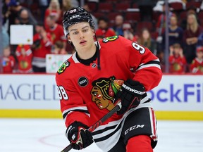 Connor Bedard of the Chicago Blackhawks warms up.