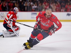 Alex Ovechkin and Darcy Kuemper of the Washington Capitals warm up.