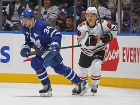 Maple Leafs' Auston Matthews (left) and Connor Bedard of the Chicago Blackhawks watch the play during the second period at Scotiabank Arena on Monday, Oct. 16, 2023 in Toronto.