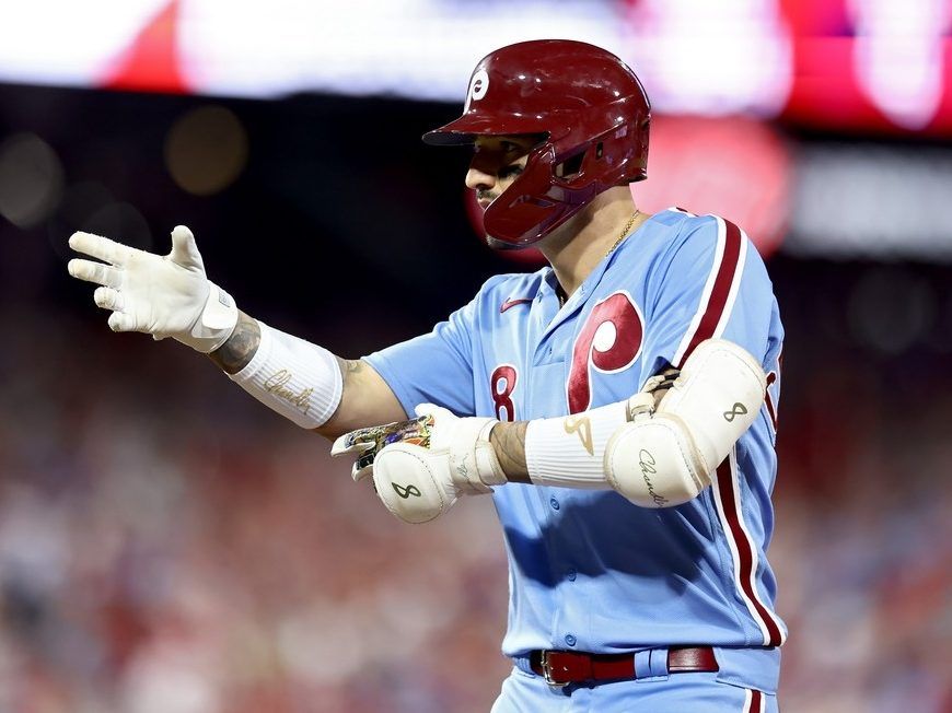 Philadelphia Phillies - Photo of Nick Castellanos wearing the powder blue  Phillies jersey in the dugout.