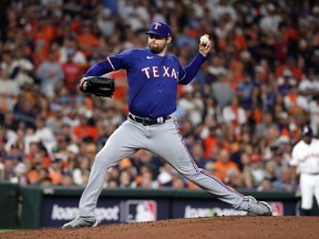 Jordan Montgomery #52 of the Texas Rangers pitches in the sixth inning against the Houston Astros during Game One of the American League Championship Series at Minute Maid Park on October 15, 2023 in Houston, Texas.