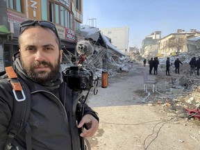 In this photo provided by Reuters, Issam Abdallah, a videographer for the news agency, poses for a selfie while working in Maras, Turkey, on Feb. 11, 2023.