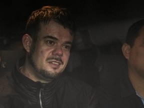 Dutch citizen Joran van der Sloot is driven in a police vehicle from a maximum-security prison to an airport to be extradited to the U.S., on the outskirts of Lima, Peru, Thursday, June 8, 2023.