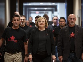 Unifor national president Lana Payne leads the way towards a meeting with Stellantis as part of the auto talks in Toronto on Thursday, Aug.10, 2023.