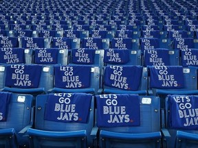Towels are placed on seats before a Toronto Blue Jays game.