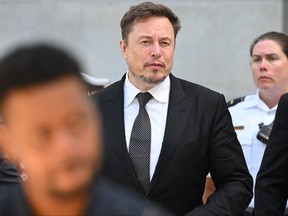 X Corp. chair and owner Elon Musk leaves a U.S. Senate forum.