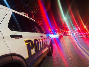 This handout image released by the Baltimore Police Department on X, formerly known as Twitter, shows police vehicles at the scene of an active shooter situation near Morgan State University in Baltimore, Md., on Oct. 3, 2023.
