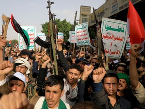 People brandishing weapons take to the streets of Yemen's Huthi-held capital Sanaa in a show of support for Palestinians on October 7, 2023, in support of the Palestinians, after the militant group Hamas launched a surprise large-scale attack against Israel, on Oct. 7, 2023.