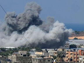 Smoke billows after an Israeli air strike in Rafah in the southern Gaza Strip on October 16, 2023.