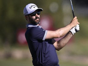 Adam Hadwin of Canada plays a shot on the 18th hole during the third round of the Shriners Children's Open at TPC Summerlin in Las Vegas, Saturday, Oct. 14, 2023.