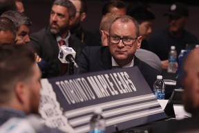 M Brad Treliving sits at the crowded Leafs table at the 2023 NHL draft in Nashville. The league plans to scrap the great NHL tradition of hockey organizations gathering under one roof for the draft. GETTY IMAGES