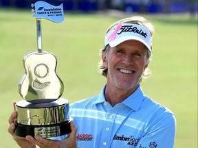 Brett Quigley poses with the trophy after winning the Constellation FURYK & FRIENDS presented by Circle K at Timuquana Country Club on Oct. 8, 2023 in Jacksonville, Fla.