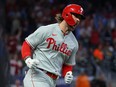 Phillies' Bryce Harper reacts as he rounds the bases after hitting a home run during the sixth inning against the Braves in Game 1 of the NL Division Series at Truist Park in Atlanta, Saturday, Oct. 07, 2023.