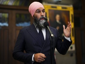 NDP Leader Jagmeet Singh speaks to reporters in the foyer of the House of Commons on Parliament Hill in Ottawa on Wednesday, Oct. 4, 2023.