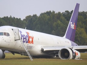 A FedEx 757 sits on a landing strip Thursday, Oct. 5, 2023 at the Chattanooga Metropolitan Airport after crash landing late Wednesday evening. (Olivia Ross /Chattanooga Times Free Press via AP)