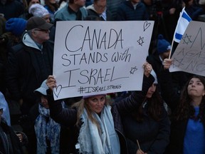 People attend a rally in support of Israel in Toronto on Monday, Oct. 9, 2023.