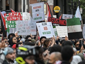 People take part in a protest in support of Palestine in Montreal, Friday, October 13, 2023. THE CANADIAN PRESS/Graham Hughes