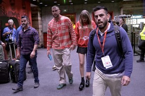 Kansas City Chiefs tight end Travis Kelce and singer Taylor Swift leave Arrowhead stadium after the Chiefs game on Sunday, Oct. 22, 2023.