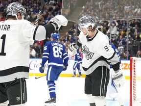 Los Angeles Kings' Adrian Kempe (right) celebrates after scoring against the Toronto Maple Leafs during third period NHL hockey action in Toronto, on Tuesday, October 31, 2023.