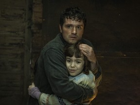 This image released by Universal Pictures shows Josh Hutcherson, left, and Piper Rubio in a scene from "Five Nights at Freddy's."