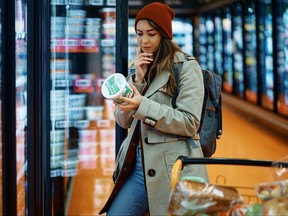 Young woman shopping in a grocery store.