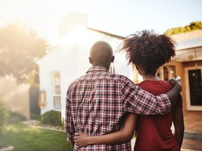 Back view, black couple and hug outdoor at house, real estate and new loan for luxury home. Man, woman and people in front of property investment, moving and dream neighborhood for building mortgage
