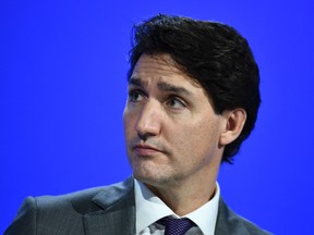 Justin Trudeau against a blue background