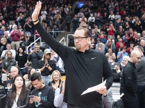Former Raptors coach Nick Nurse salutes crowd.