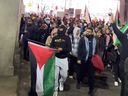 Palestine supporters march in downtown Toronto near Union Station.
