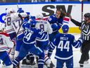 Toronto Maple Leafs Tyler Bertuzzi and Auston Matthews during a tussle with the Montreal Canadiens in 3rd period action during the home opener at the Scotiabank Arena in Toronto on Wednesday October 11, 2023. 