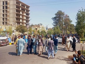 People gather on the streets in Herat