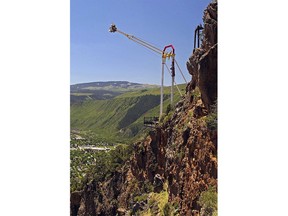 People ride the Giant Canyon Swing at Glenwood Caverns Adventure Park in Glenwood Springs, Colo., June 10, 2011. A heavily armed man killed himself rather than carry out an apparent plan to shoot up the mountaintop amusement park in Colorado, authorities said Monday, Oct. 30, 2023.