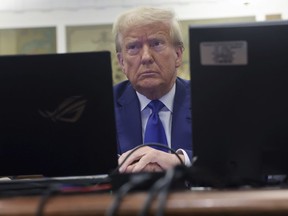 Former President Donald Trump waits for the continuation of his civil business fraud trial at New York Supreme Court, Wednesday, Oct. 25, 2023, in New York.