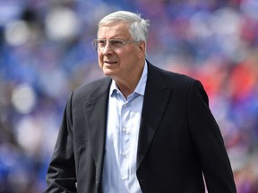 FILE - Buffalo Bills co-owner Terry Pegula walks on the field before the team's NFL football game in Orchard Park, N.Y., Sept. 17, 2023. John Roth, the newly appointed chief operating officer of the Bills and the NHL's Buffalo Sabres, was fired Wednesday along with the Bills' general counsel, Kathryn D'Angelo, because the two were in a romantic relationship, a person briefed on the matter told The Associated Press. Roth had been appointed COO of the Bills in July following a management shakeup involving both teams, which are owned by Terry and Kim Pegula. In a joint telephone interview with The AP, Roth and D'Angelo confirmed they were dismissed without going into detail.