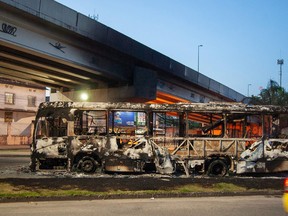 A bus that was set on fire by suspected paramilitary militia members