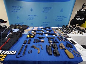 CBSA officers raided a Vaughan residence and allegedly seized an assortment of guns and ammunition, cocaine, police uniforms, law enforcement badges and ID cards, bulletproof vests and stun guns on May 24, 20023.