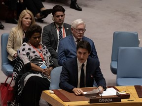 Bob Rae, Canada's ambassador to the United Nations, sits with members of the Canadian delegation as Prime Minister Justin Trudeau speaks at the UN Security Council in New York, Wednesday, Sept. 20, 2023.