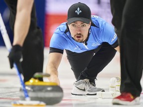 Quebec skip Félix Asselin watches his shot during his match against P.E.I. at the 2023 Tim Hortons Brier at Budweiser Gardens in London, Ont., Sunday, March 5, 2023. Canada improved to 3-0 at the World Mixed Curling Championship with a 7-2 seven-end victory over Australia on Sunday.