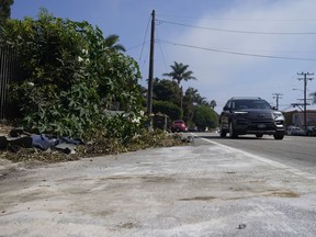 Debris is seen along the Pacific Coast Highway