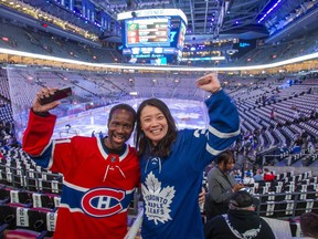 Ralph D'Almeida and Atsuko Yasuda before the Toronto Maple Leafs host the Montreal Canadiens at the Scotiabank Arena for the season opener in Toronto on Wednesday, Oct. 11, 2023.