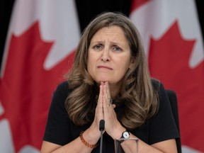 Deputy Prime Minister and Minister of Finance Chrystia Freeland listens to a question during a news conference Tuesday, October 24, 2023 in Ottawa.